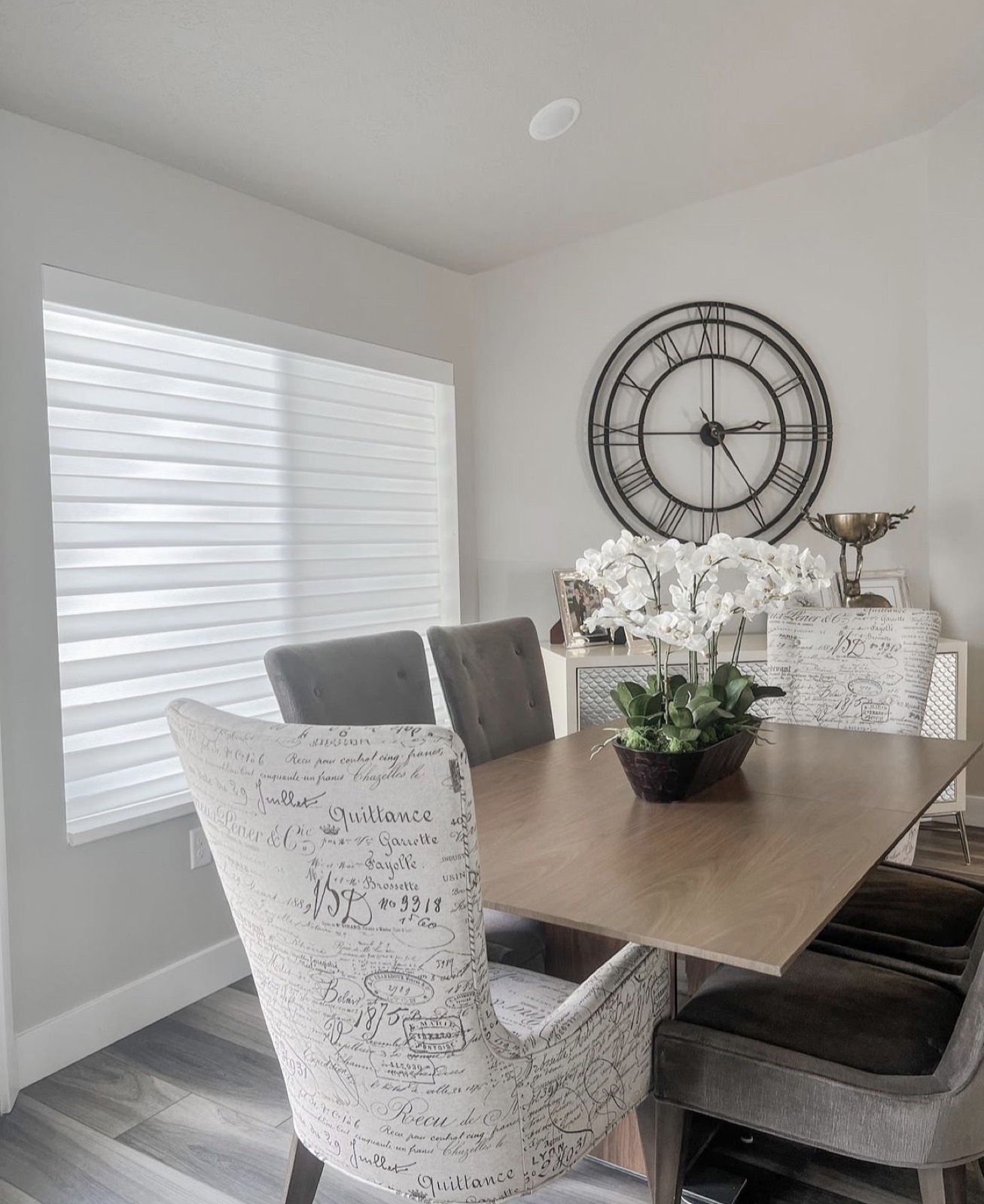 Sheer roller shades along a dining hallway