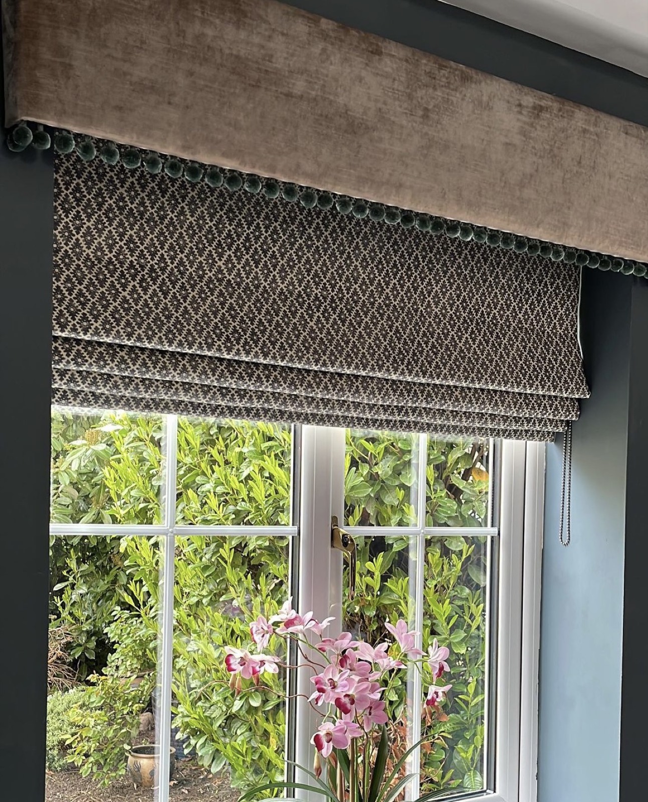 Detail of a custom Roman shade with velvet trim by Luxe Blinds New York